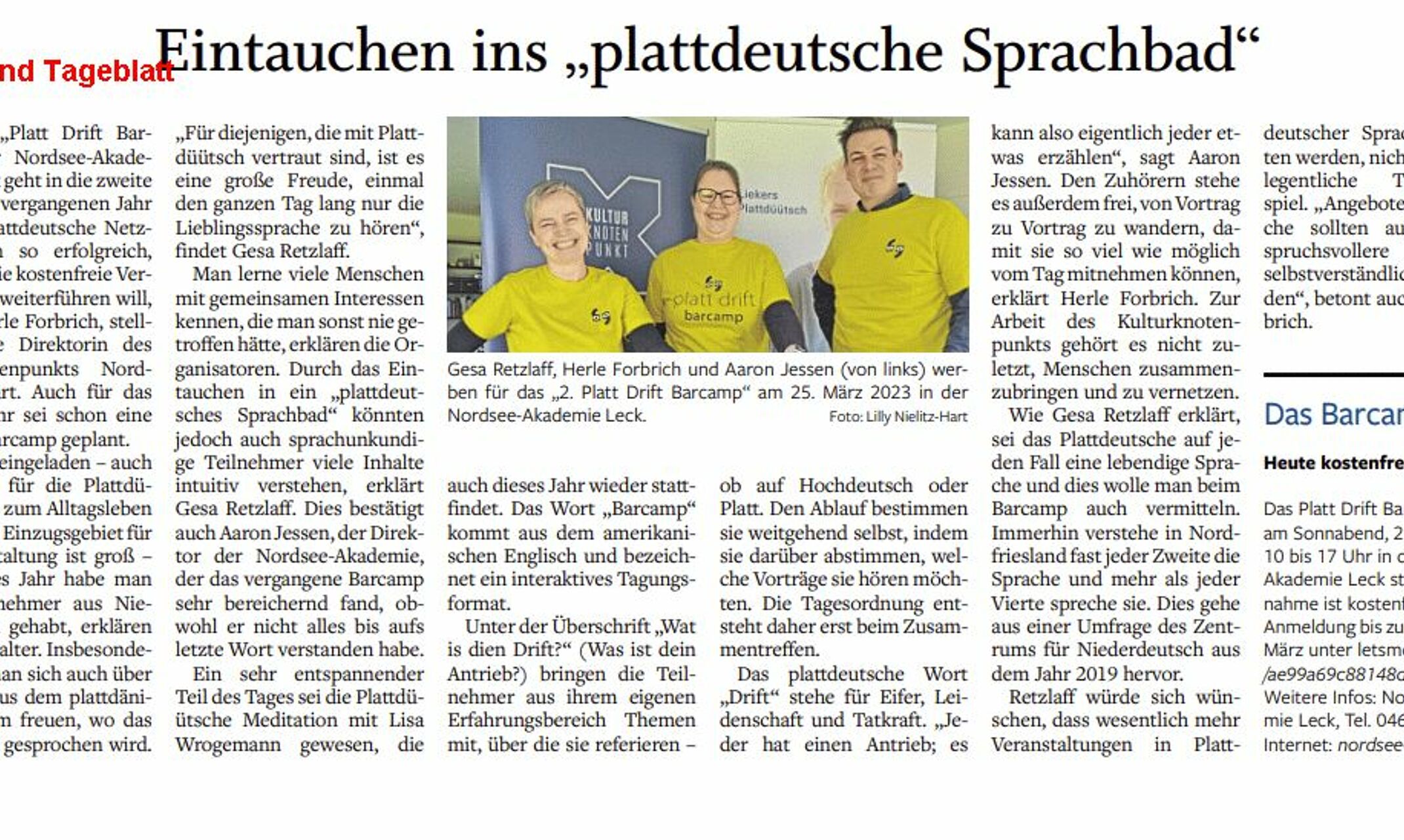 Zeitungsartikel über die Veranstaltung mit einem Bild der Veranstalter