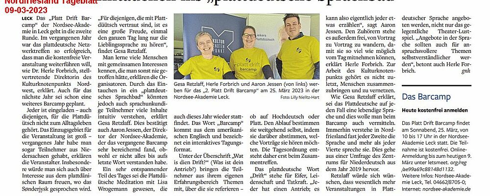 Zeitungsartikel über die Veranstaltung mit einem Bild der Veranstalter