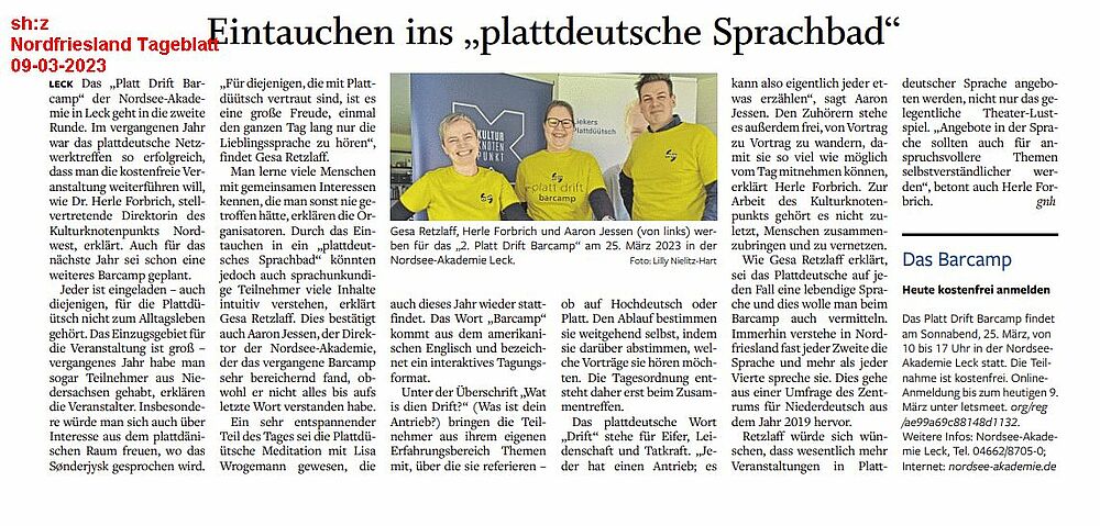 Zeitungsartikel über die Veranstaltung mit einem Bild der Veranstalter